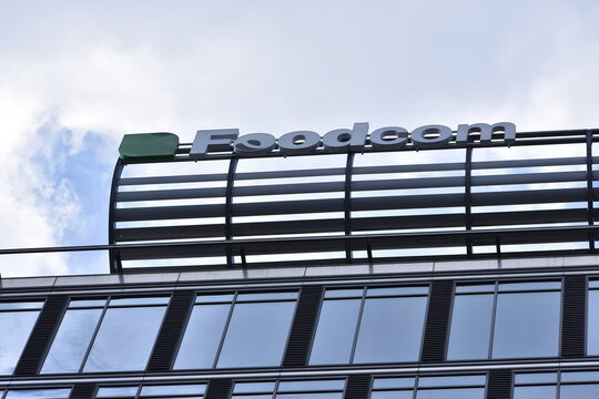 Foodcom company office with logo, emblem, signage on the facade. WARSAW, POLAND - APRIL 25, 2026