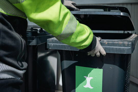 man with recycling bin