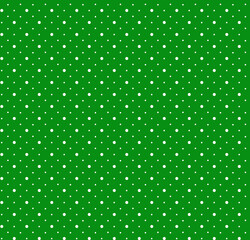 Bright green polka dot seamless pattern background with white circular dots texture © Wolfworker