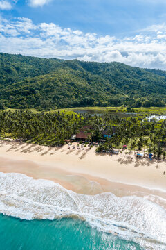 Aerial view of Nacpan beach with perfect sand and palm trees on the island of Palawan in the Philippines 