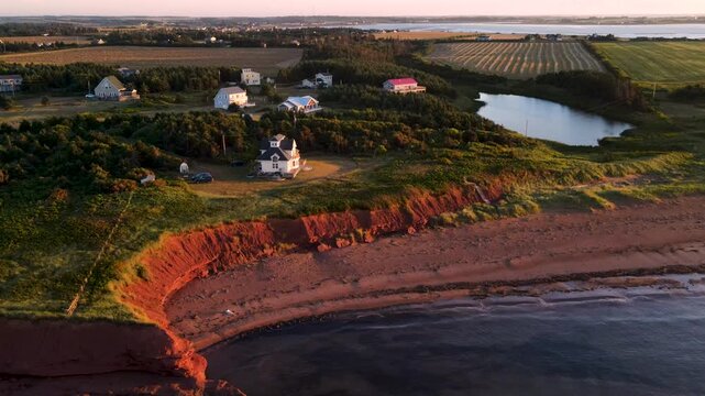 Coastal homes, farmland and red cliffs on Prince Edward Island, Canada