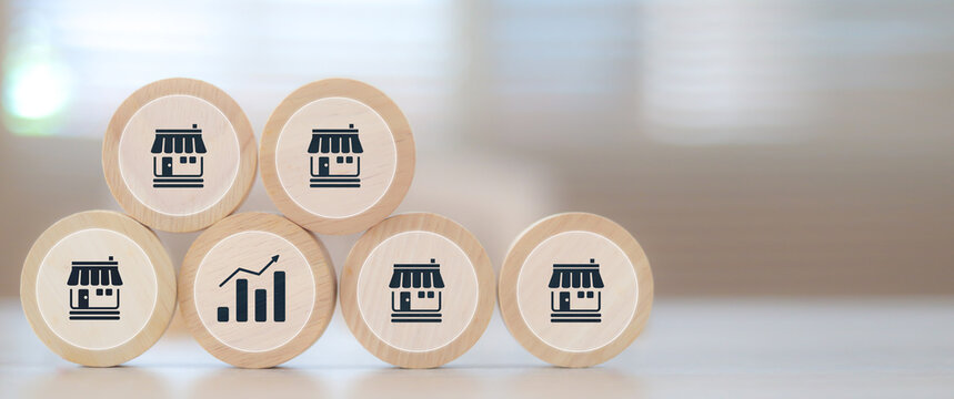 Wooden toy stack with franchise icon for goal to growth is investment planning financial and branch expansion and management bank loans for marketing franchising.