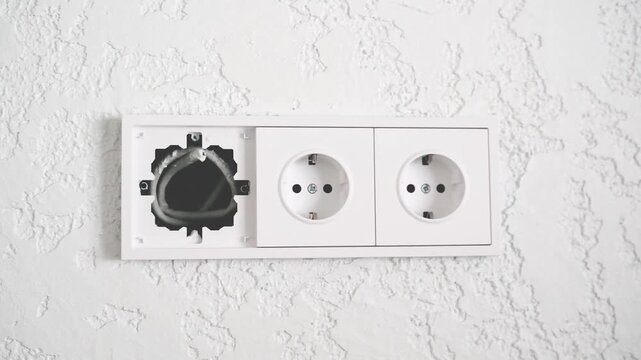 electrical outlet installation on textured wall