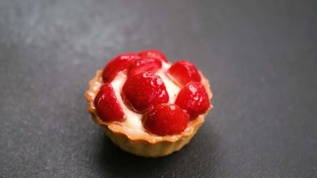Strawberry tart on a dark background