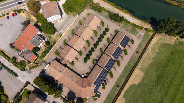 Aerial View of Residential Buildings and Farmland: An elevated perspective showcases modern residential buildings with solar panels, Tavazzano con Villavesco, Lodi, Italy