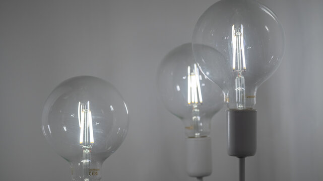 Row of classic filament light bulbs illuminating a cozy space
