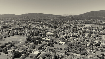 Fototapeta premium Cinematic drone view of Pistoia and surrounding Tuscan countryside.