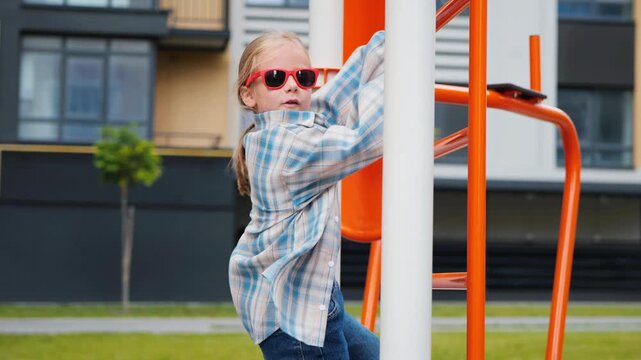 Fashionable Girl Climbing Playground While Dancing