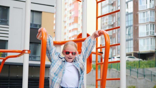 Happy Blonde Girl Singing And Dancing On Playground