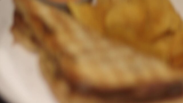 Close up of bread and chips 4K video, fresh bread slices with crispy potato chips on a table, delicious snack and bakery food concept, detailed texture and appetizing food scene in ultra HD