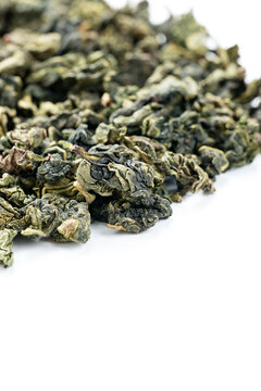 Aromatic Tie Guan Yin detail on clean white backdrop