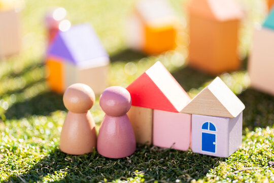 Couple with home concept depicted in childs toy blocks on fake grass