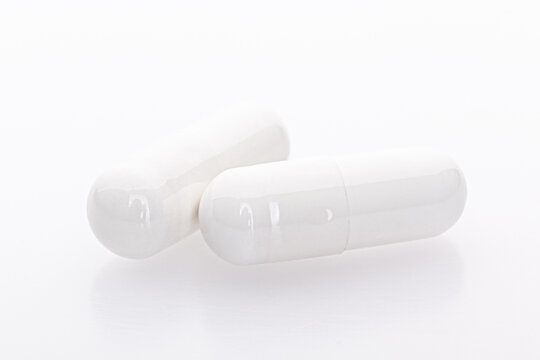White capsule medicines isolated on white background