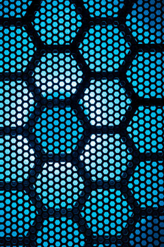 Close-up of hexagonal vent patterns on illuminated gaming rig