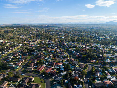 Buildings and streets with landscape aerial view over rooves and homes of Singleton