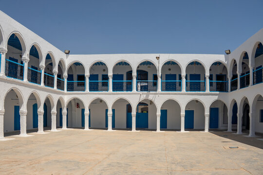 Arched patio around the courtyard in the building for visiting scholars, at El Ghriba Synagogue in Erriadh, on the Isle of Djerba, Tunisia