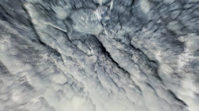 Macro close up shot zooming in on frozen ice surface with detailed cracks and frost textures.