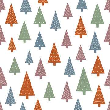 Seamless pattern with hand drawn colorful pine trees for winter holiday wrapping paper and festive textile design