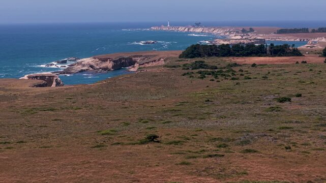 Explore the beauty of Point Arena Lighthouse from the Coastal Trail while enjoying the vast Pacific Ocean and headlands in California.