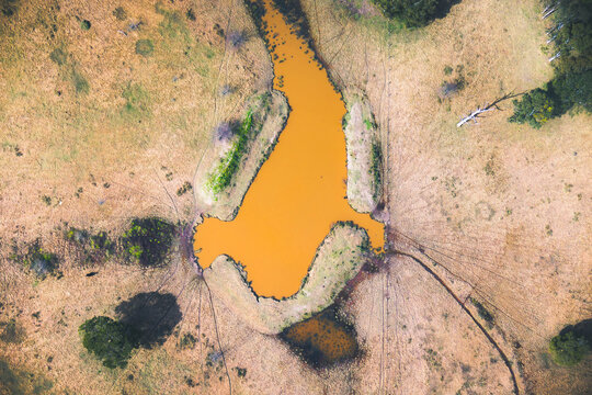 An aerial overhead view of a dam in Vineyard, northwestern Sydney