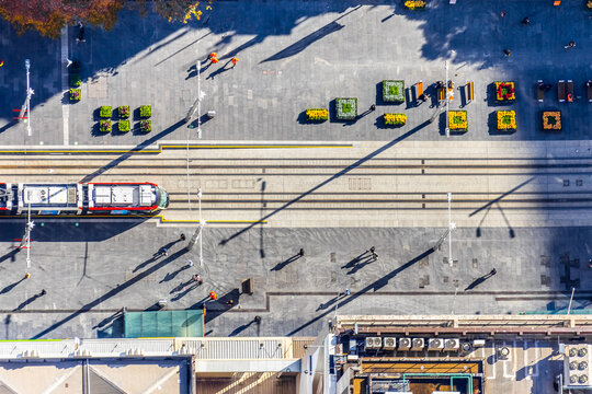 Aerial view of a city tramway and pedestrian plaza
