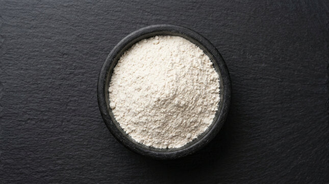 Close-up of white powdery substance on dark background