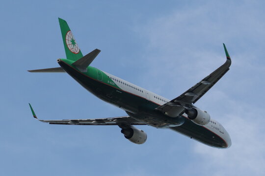 An EVA Air passenger plane flies through the sky.