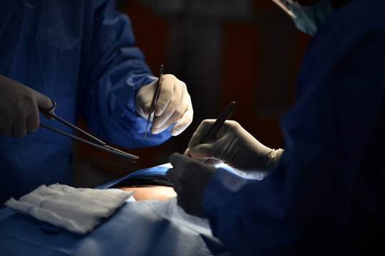 Surgeons Performing Surgical Procedure in Operating Room During Operation
