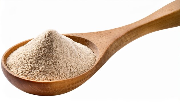 active dry yeast in wooden spoon isolated on a white background