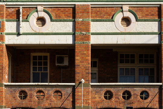 Peeling paint on brick facade of the royal oak hotel