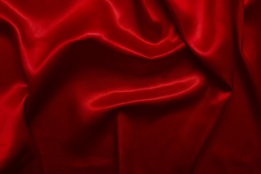 Elegant and beautiful smooth red satin fabric surface for illustrations.