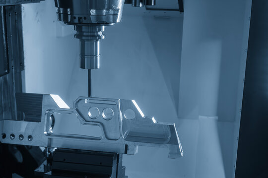 High-precision 5-axis CNC milling machine cutting an aerospace part with a flat nose end mill tool.