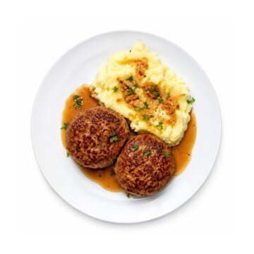 Frikadellen mit Kartoffelp&uuml;ree, Bratenso&szlig;e und R&ouml;stzwiebeln als deutsche Klassiker. Herzhafte Hausmannskost auf wei&szlig;em Teller, isoliert auf Wei&szlig; und aus der Vogelperspektive.