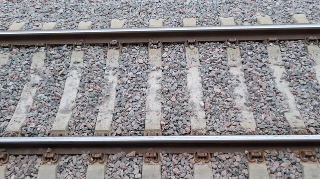 Railway tracks extending into the distance, transportation infrastructure, engineering, travel, and industrial connection concept.