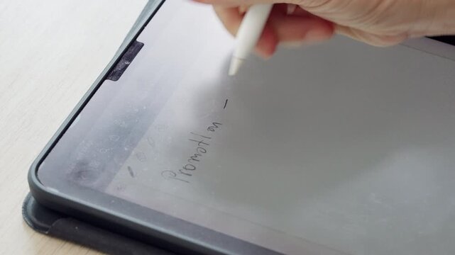 A close-up of handwritten notes on a tablet using a stylus pen, illustrating digital documentation, paperless office workflow, smart productivity, education, project management, and business technolog