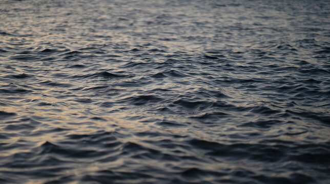 A water surface with small waves, a beautiful ocean closeup.