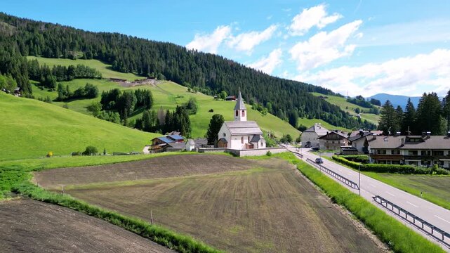 San Vito Bolzano Italy Dolomites with church by drone