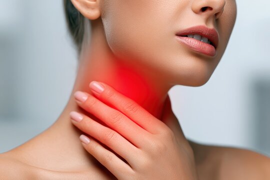 Woman touches neck to thyroid gland disease symptoms. Glowing red sign on throat. Endocrine inflammation hypothyroidism goiter node or larynx pain. Lymph node screening, hormones. Awareness campaign