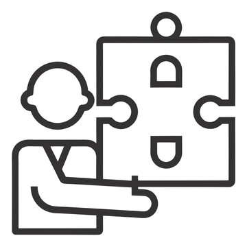Business professional holding large puzzle piece symbolizing strategy implementation and problem solving in corporate teamwork environments.