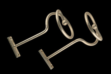 Metal chrome curtain rod Spiral on a black background, close-up. © Oleksandr