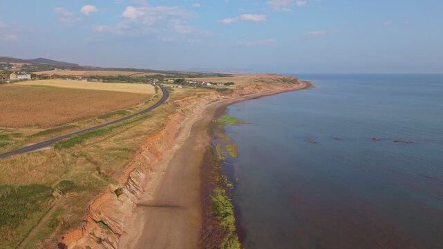 Aerial drone footage of Compton Bay and Brook Chine Beach on the south-west coast of the Isle of Wight, England, showcasing dramatic cliffs, golden sands, turquoise water, and the spectacular coast