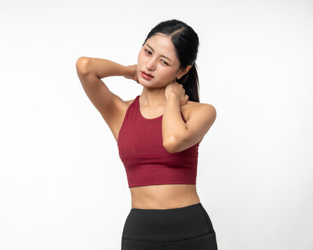 Sporty asian woman inflamed neck shoulder arm wrist and backache because she is workout exercise too much. Accident suffering while training workout. Massage to soothe relax on isolated background.
