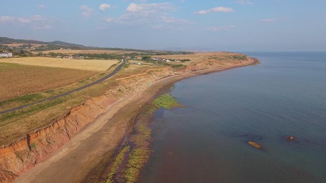 Aerial drone footage of Compton Bay and Brook Chine Beach on the south-west coast of the Isle of Wight, England, showcasing dramatic cliffs, golden sands, turquoise water, and the spectacular coast