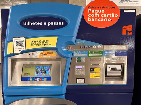 Passengers purchase tickets at Lisboa Oriente train station using a Lisbon Metro self-service machine with touchscreen, bank card, cash and travel card payment options, Lisbon, Portugal, 2 April 2026