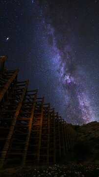 Beautiful night landscape with bright Milky Way on the  starry night sky. Old architecture. 