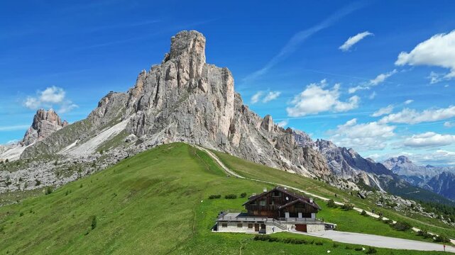 Giau Pass drive with mountains in Italy Dolomites by drone