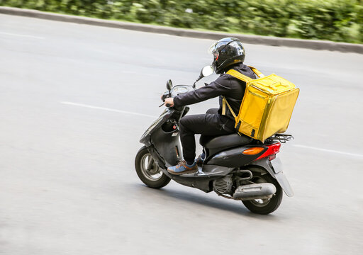 An image of a motorcycle courier used for food delivery service