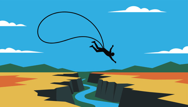 Thrilling silhouette of an extreme athlete bungee jumping over a deep canyon river landscape on a bright sunny day.