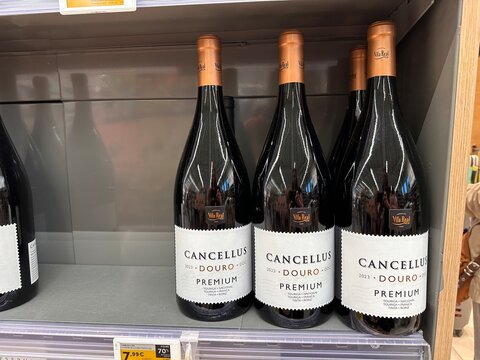 Cancellus Douro premium wine Portuguese regional red wine bottles arranged in rows on a supermarket shelf with promotional price signage in retail in store, 4 April 2026, Sintra, Portugal