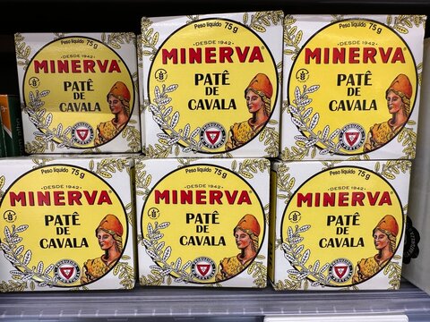 Minerva branded Portuguese mackerel p&acirc;t&eacute; tins arranged on a supermarket shelf, showing traditional seafood packaging and local culinary souvenir selection in store, 4 April 2026, Sintra, Portugal